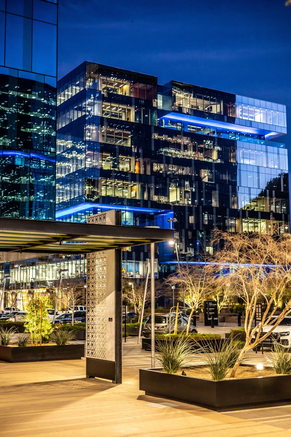 Modern shopping mall plaza illuminated at night